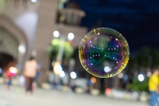 A vibrant cityscape background with a picksoap bar and its minimalist packaging in the foreground.