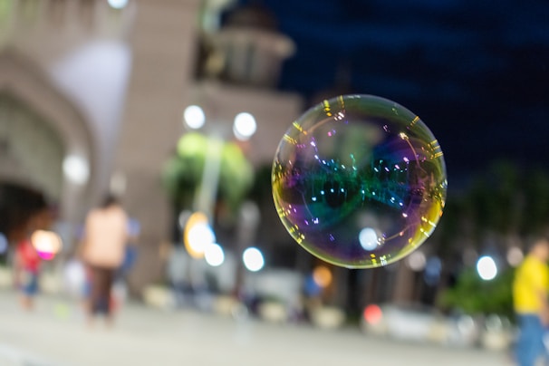 A vibrant cityscape background with a picksoap bar and its minimalist packaging in the foreground.