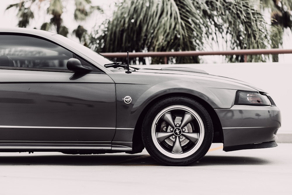 grey mercedes benz coupe on grey concrete road during daytime