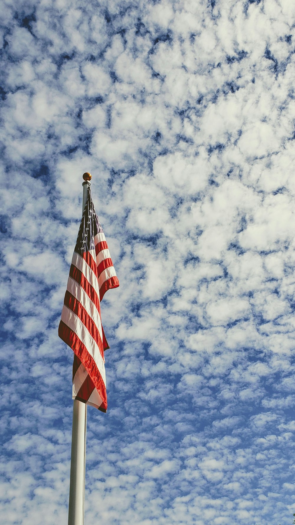 us a flag under blue sky