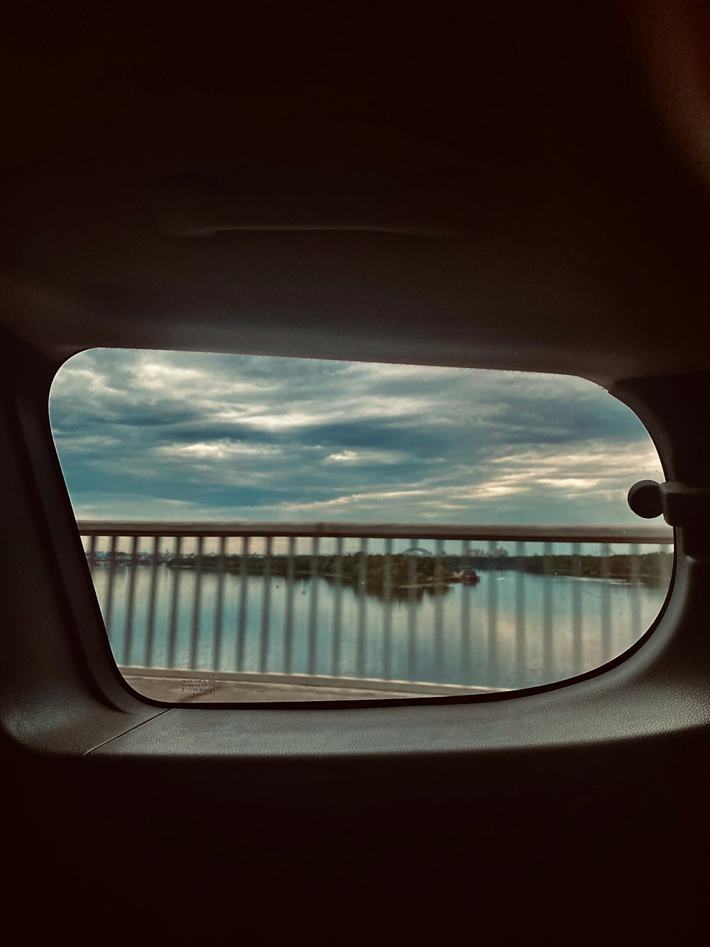 body of water under cloudy sky during daytime