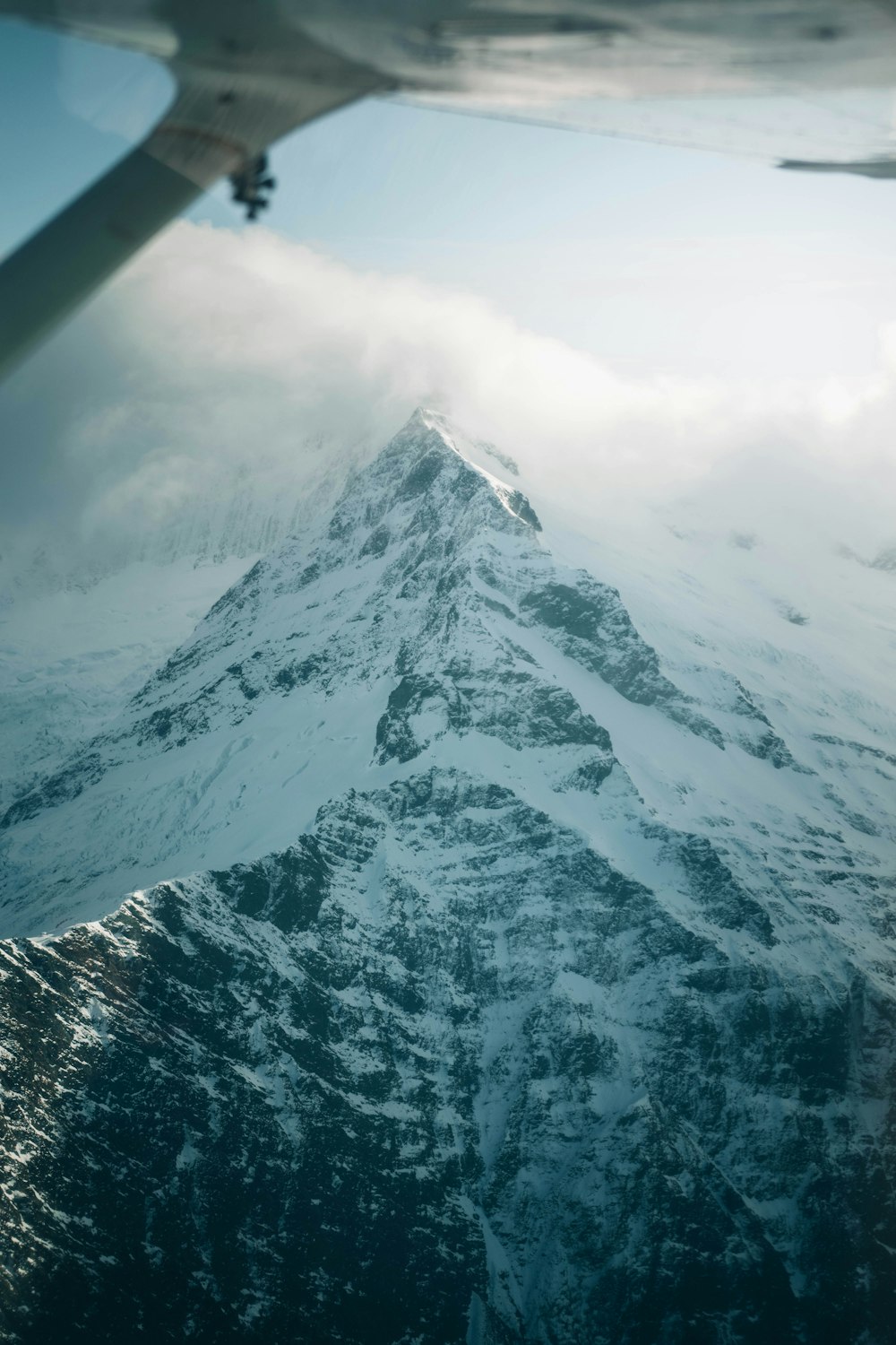 snow covered mountain during daytime