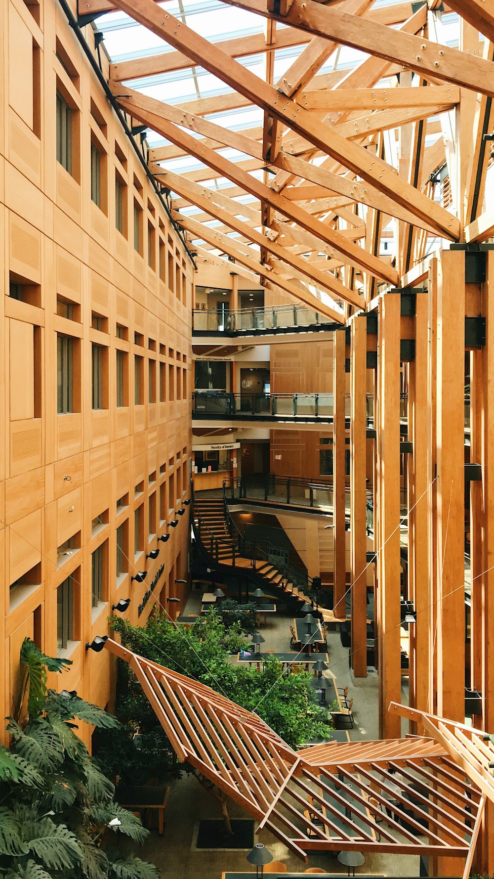 brown wooden building with green plants