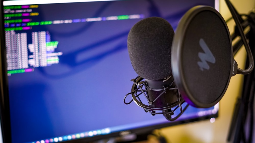 black and silver microphone on black microphone stand