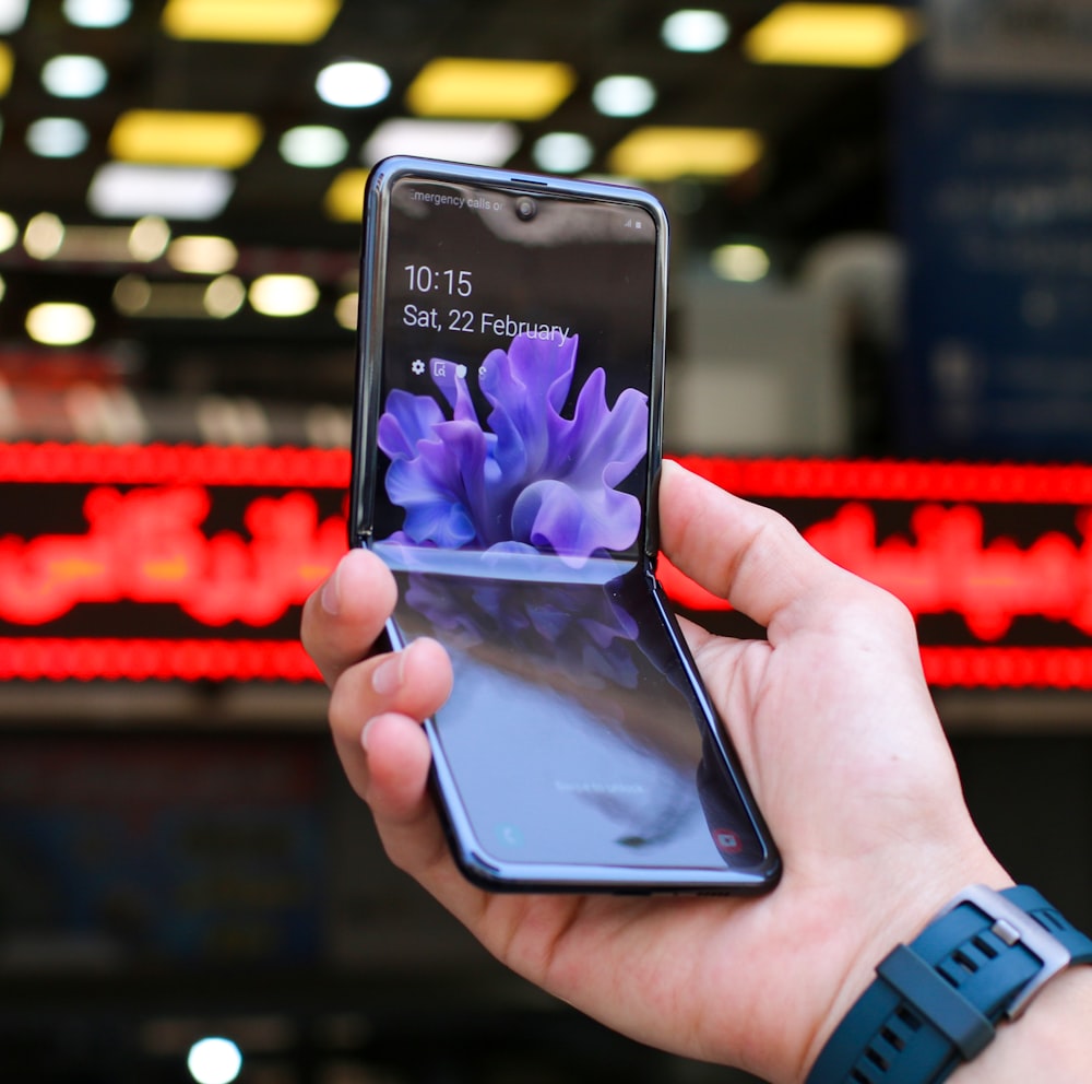 person holding black samsung android smartphone