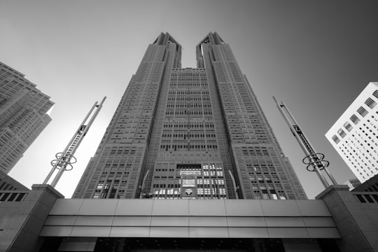 grayscale photo of high rise building in Tokyo Metropolitan Government Building Japan