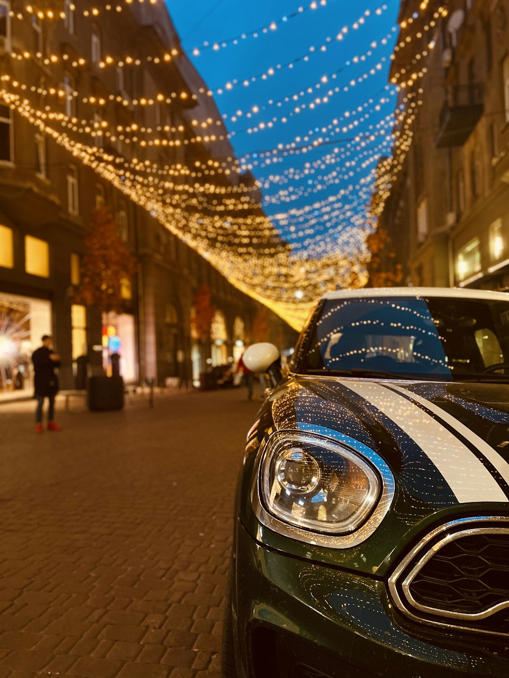 blue car on road during night time