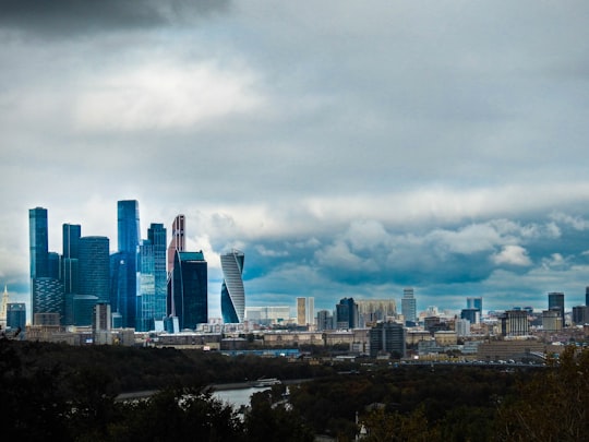 city skyline under white clouds during daytime in 麻雀山观景台 Russia