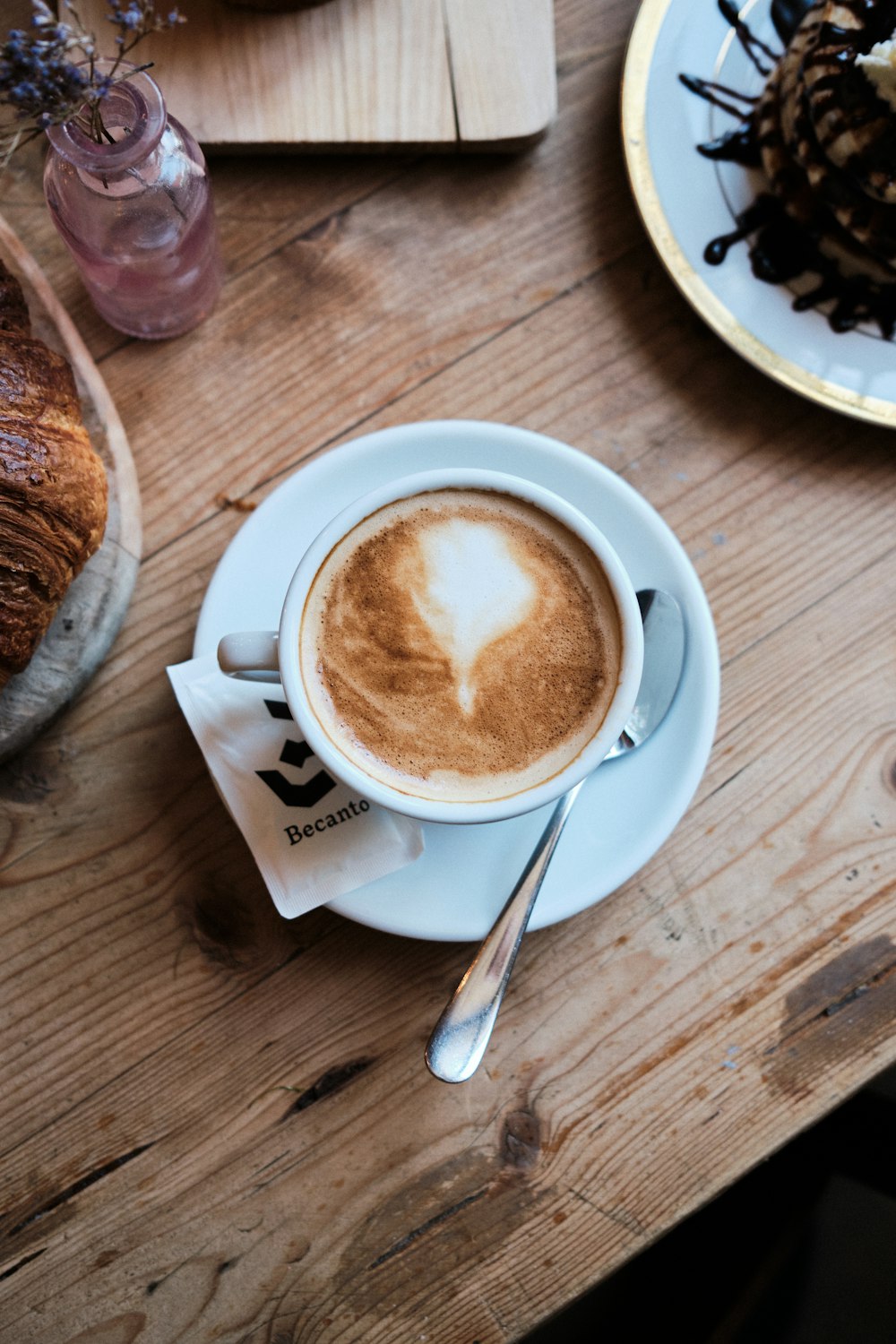 white ceramic mug with brown liquid inside