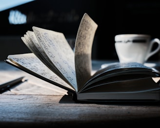 open book on brown wooden table