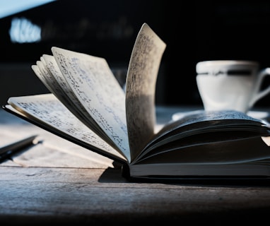 open book on brown wooden table