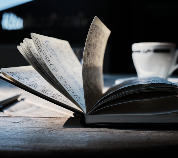 open book on brown wooden table