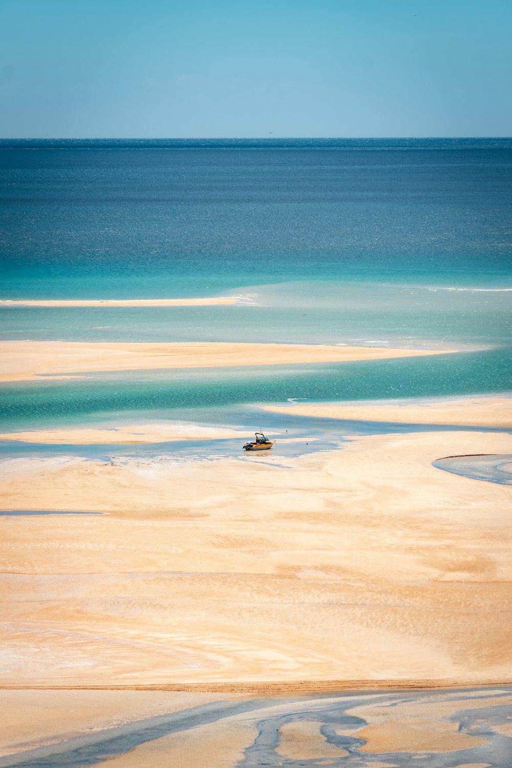 person riding on boat on sea during daytime