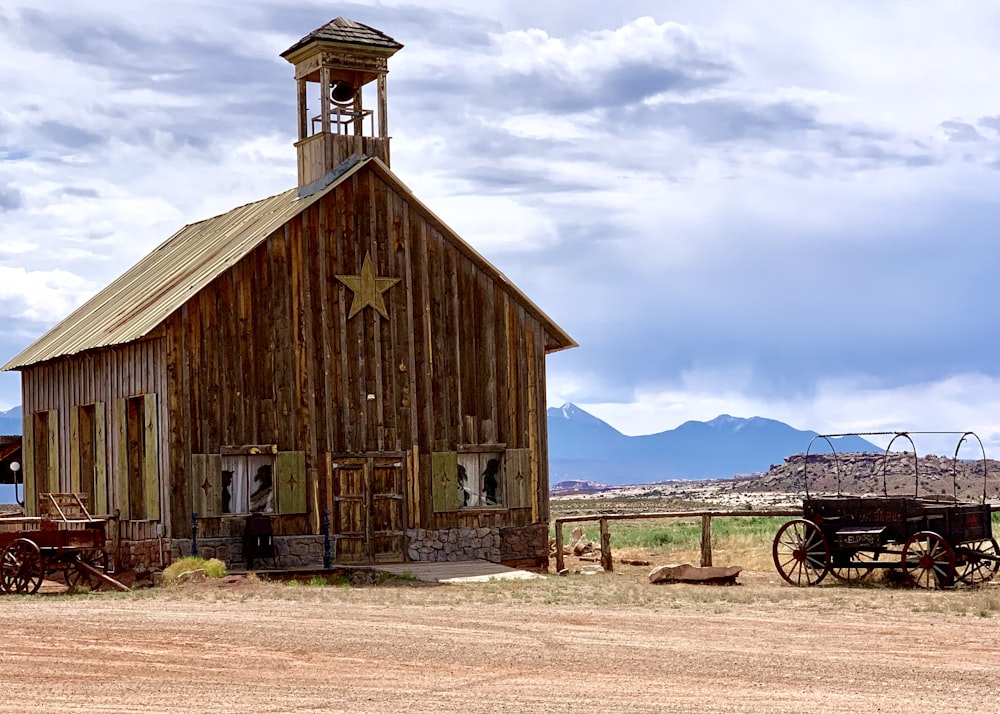 brown wooden house under white clouds during daytime