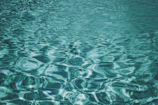 Soft focus image of water ripples creating a calming, meditative pattern.