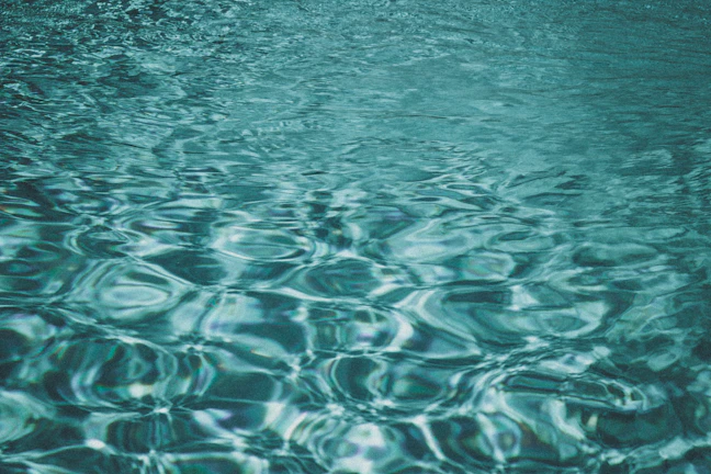 Soft focus image of water ripples creating a calming, meditative pattern.
