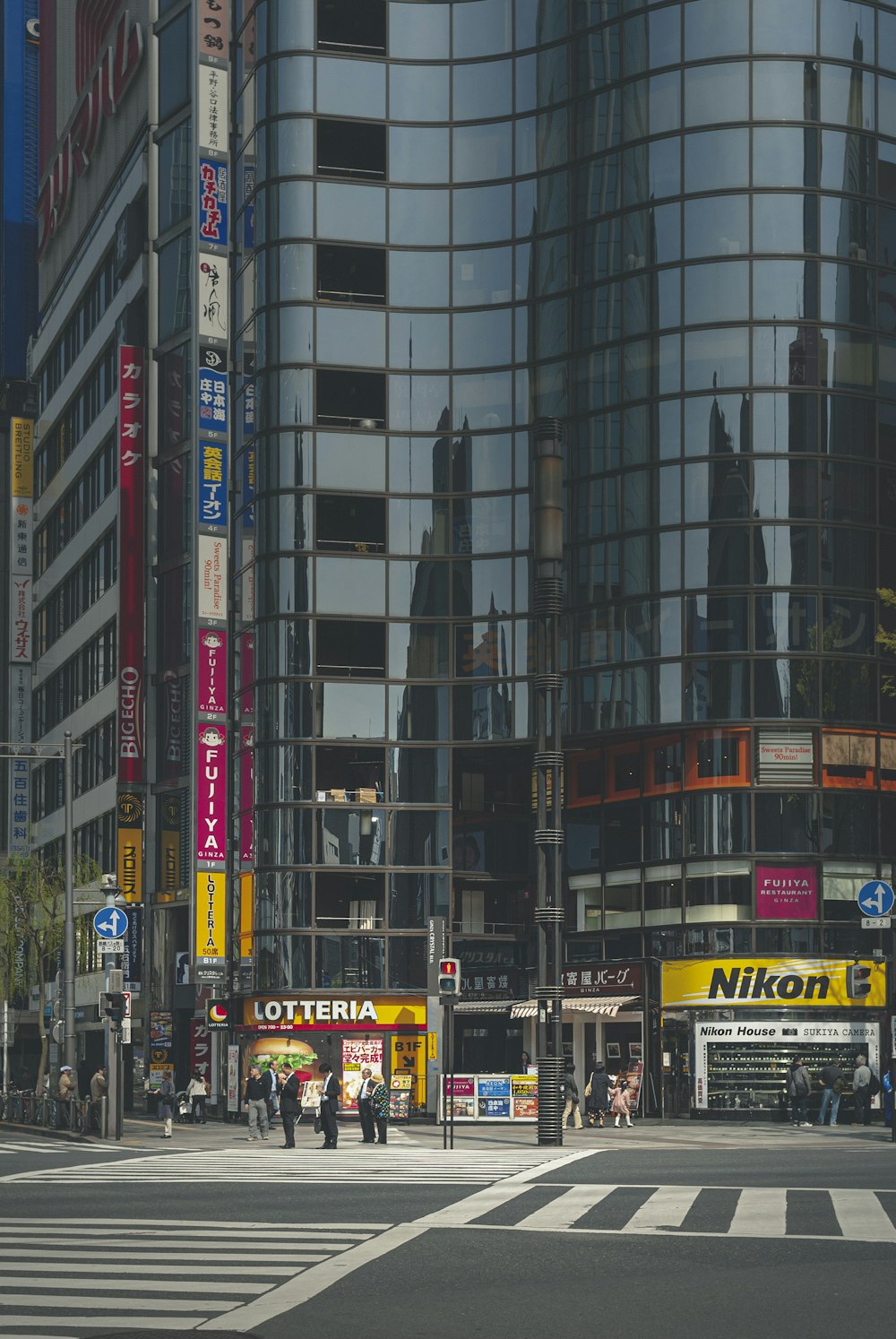 black and yellow bus on road near high rise building during daytime