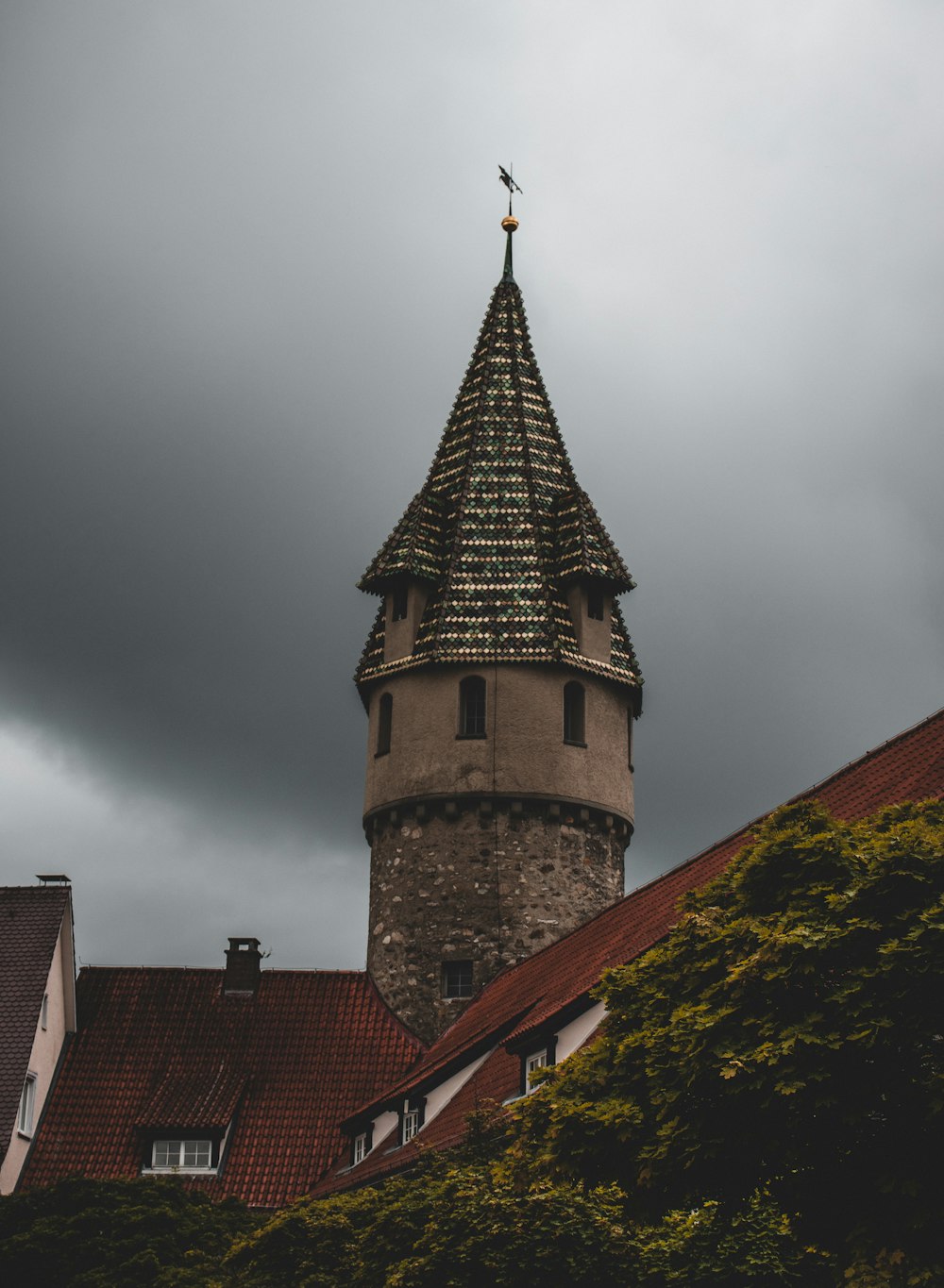 brown brick building under cloudy sky