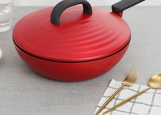 red round plastic container on table