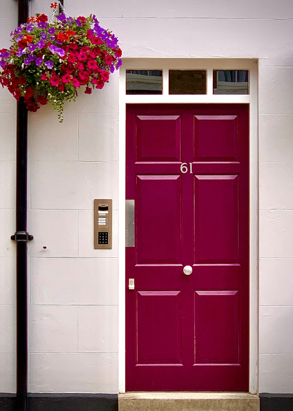 red wooden door with pink flowers