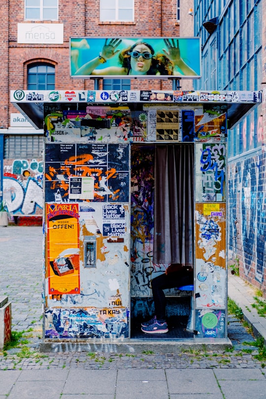 white and yellow poster on wall in Leipzig Germany