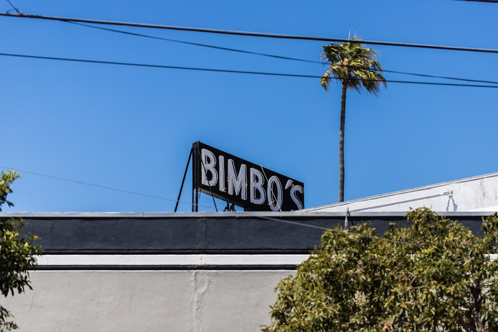 a sign that reads bumbo's on top of a building