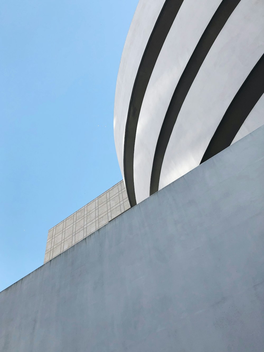 white concrete building under blue sky during daytime