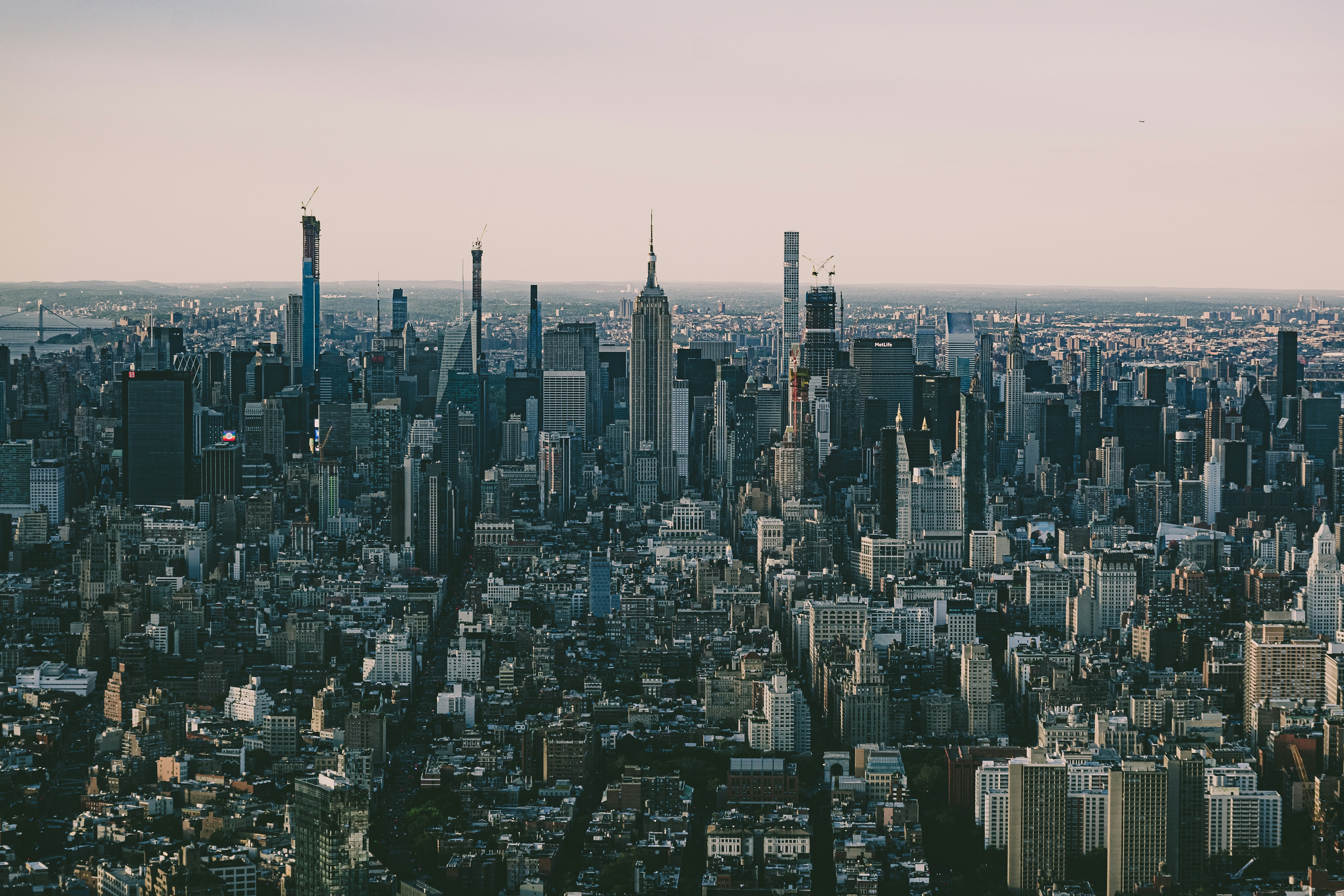 aerial view of city buildings during daytime, A retro look of the new york skyline as viewed from the One World observatory deck