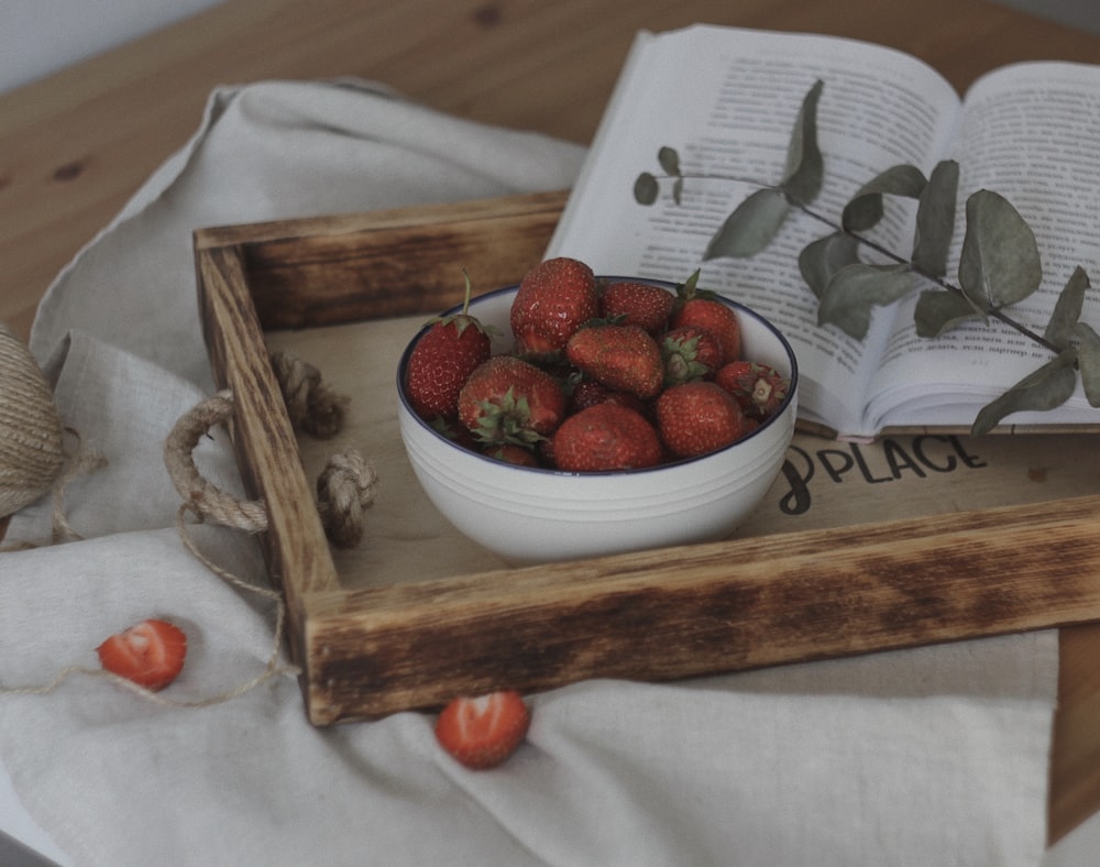 strawberries in white ceramic bowl