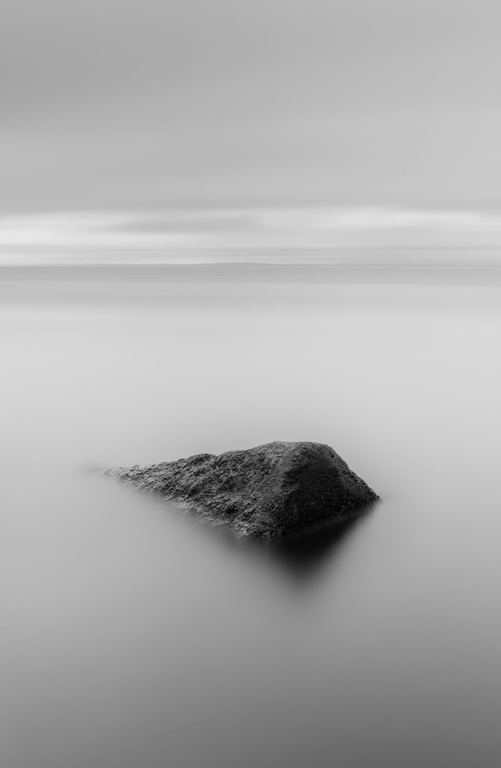 grayscale photo of body of water