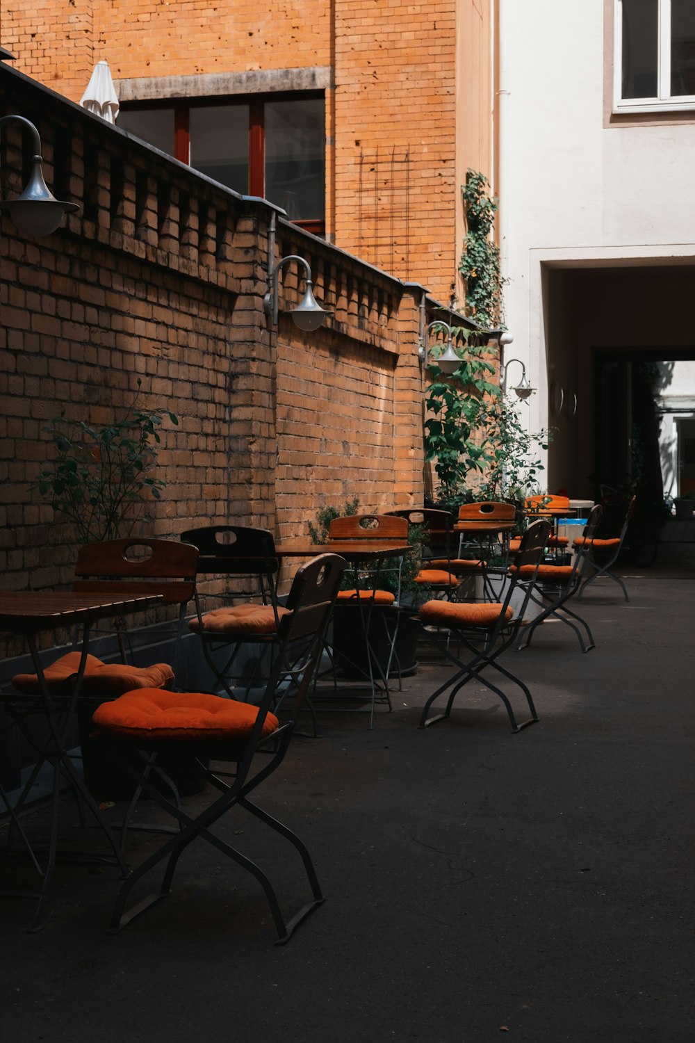 black metal framed brown wooden table and chairs