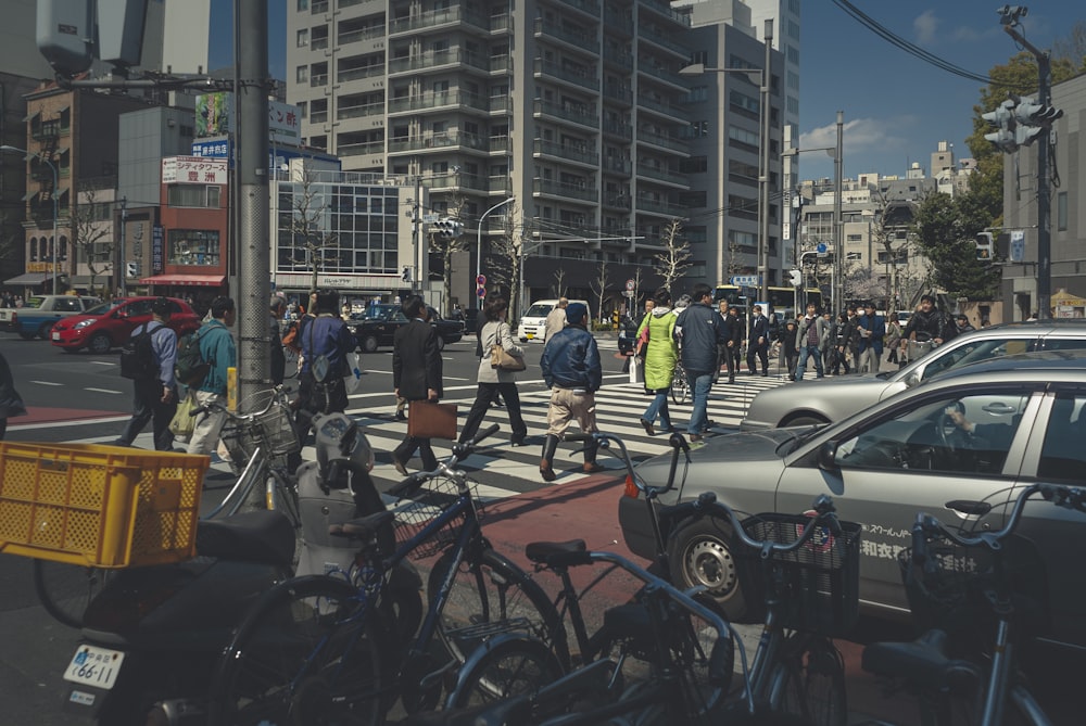 people riding bicycles on road during daytime