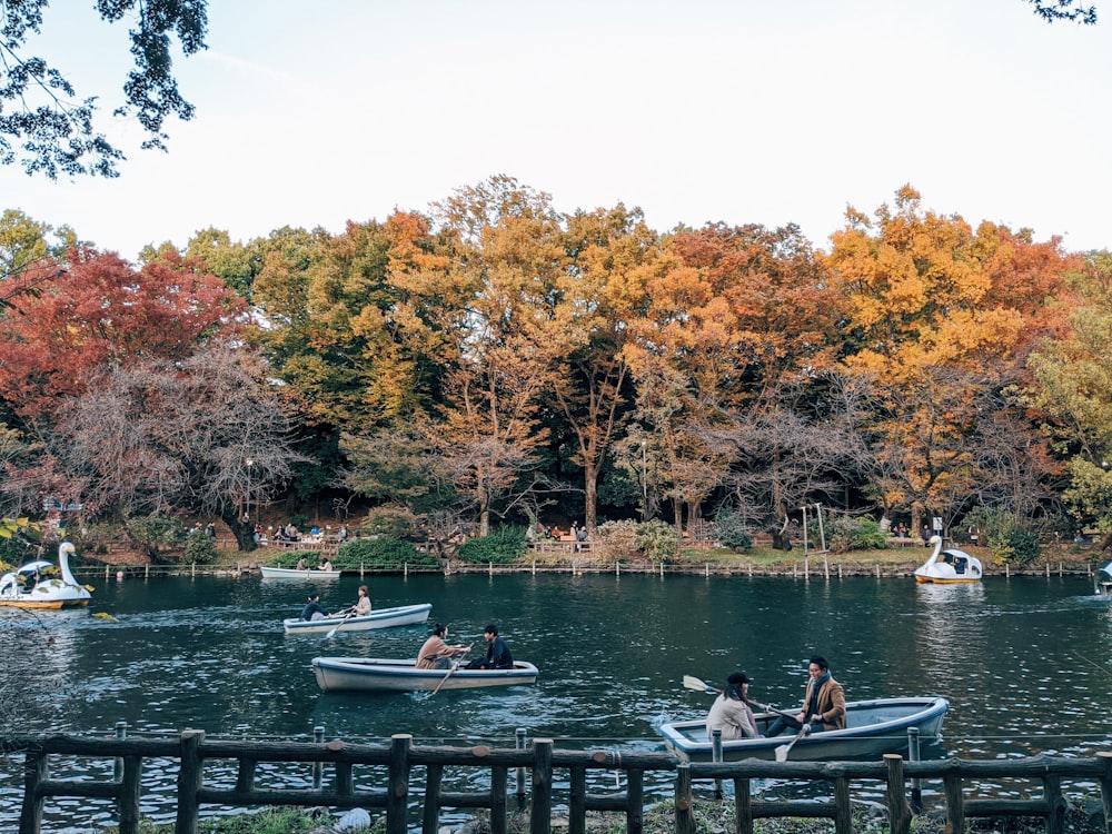 people riding on boat on river during daytime