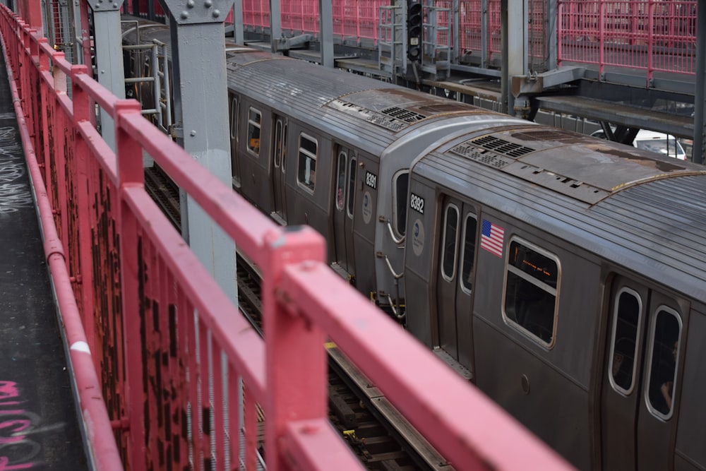 red metal railings near train