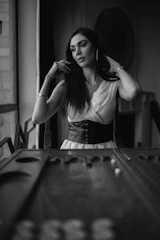 Valentina looking thoughtful near the game challenge setup.