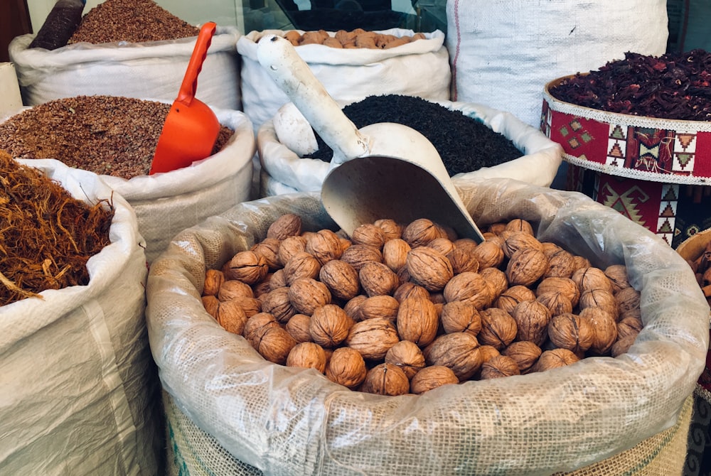 brown round fruits on white and brown round basket