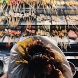A vibrant display of skewered satay with colorful vegetables.