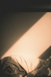 Elegant soft light highlighting the textures of a cozy corner with natural colors.