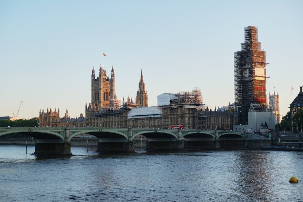 brown concrete bridge over river during daytime