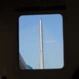Technicians installing network equipment on the Sydney Harbour Bridge at sunrise.