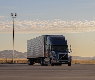 black truck on road during daytime