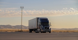 black truck on road during daytime