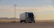 black truck on road during daytime