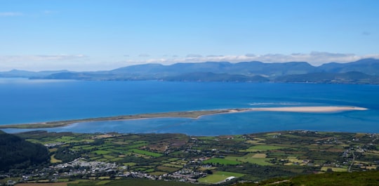 aerial view of green mountains and blue sea during daytime in Seefin Ireland