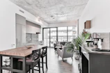 Open-concept kitchen in a stylish apartment with modern appliances.