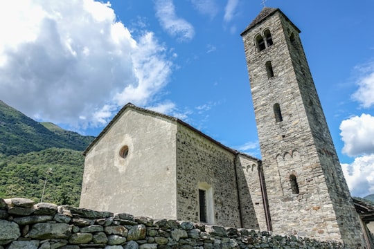 brown brick building under blue sky during daytime in Mezzovico-Vira Switzerland