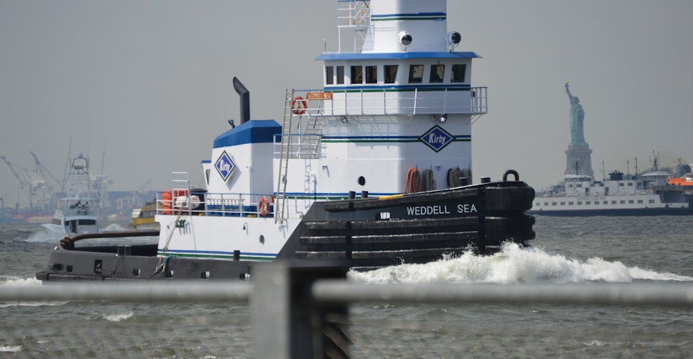 white and black ship on sea during daytime