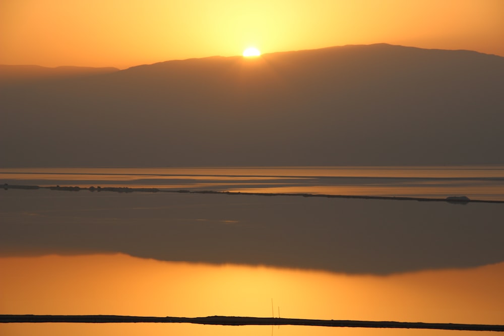 silhouette of mountain during sunset