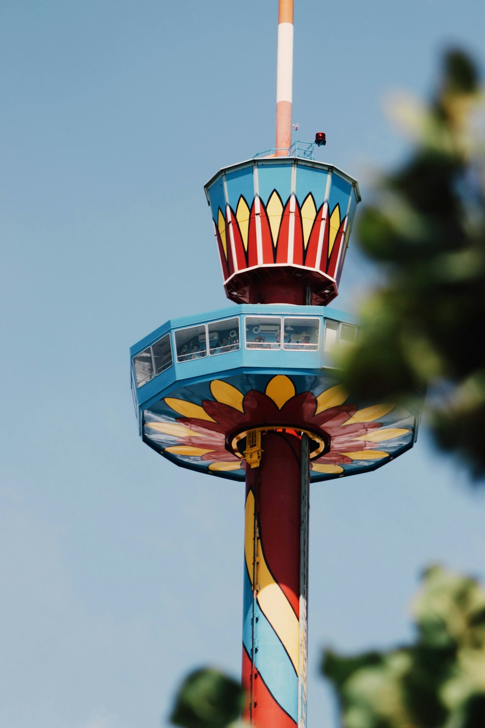 red and white tower under blue sky during daytime