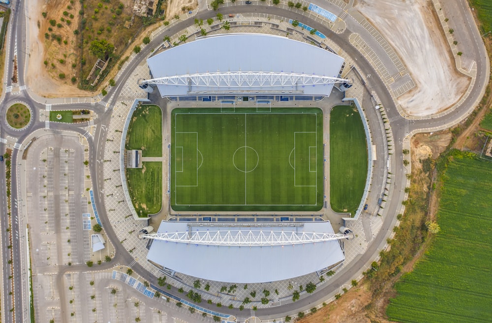 aerial view of green and white stadium during daytime